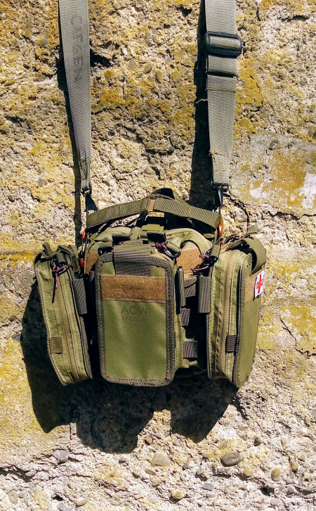 Mac-Gyver kit with 3 Sat "satellite" module pouches, hangin on a rustic wall